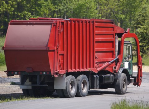 Low-emission electric waste collection van operating in Norbiton
