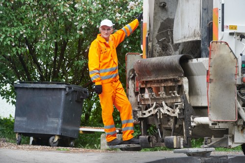 Safety supervisor reviewing risk assessment for rubbish collection